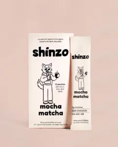 Shinzo Mocha Matcha box and individual pouch on a pale pink background