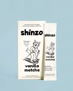 Shinzo Vanilla Matcha box and individual pouch on a light blue background
