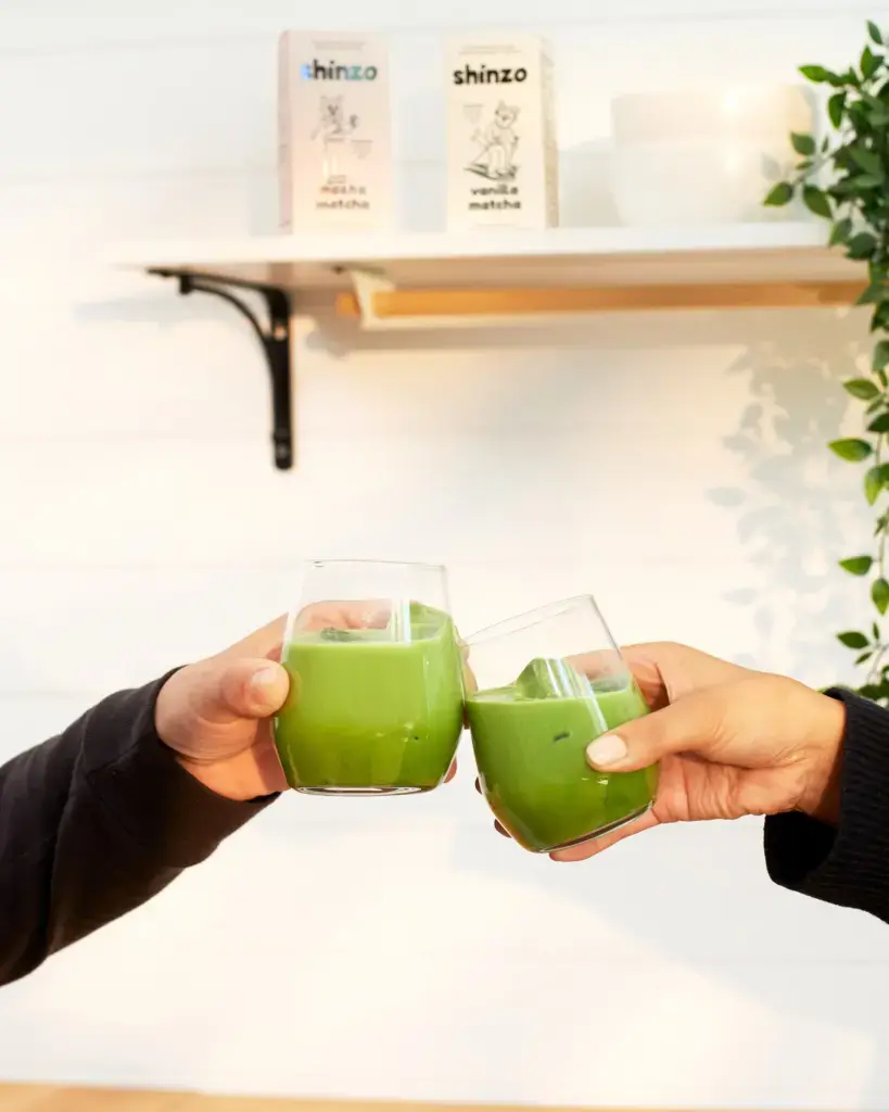 Two glasses of bright green iced Shinzo matcha