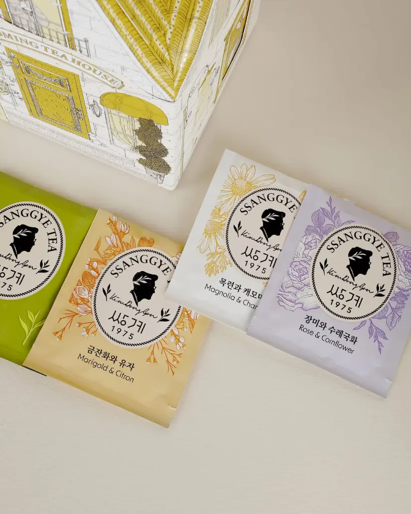 Four Ssanggye Tea sachets with green, orange, yellow, and purple floral designs