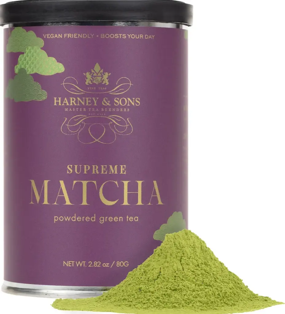 Purple Harney & Sons Supreme Matcha canister beside a mound of green matcha powder