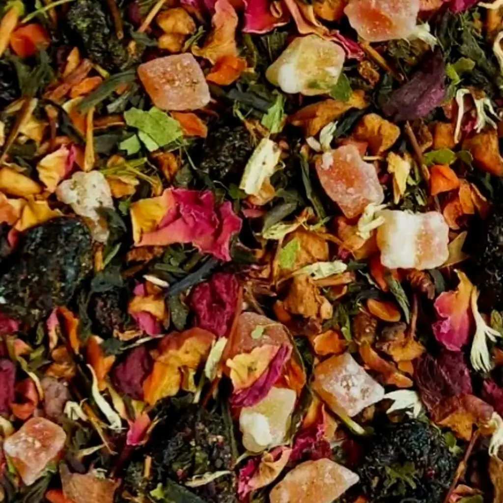 Colorful loose blend with dried leaves, flower petals, fruit pieces, and translucent cubes