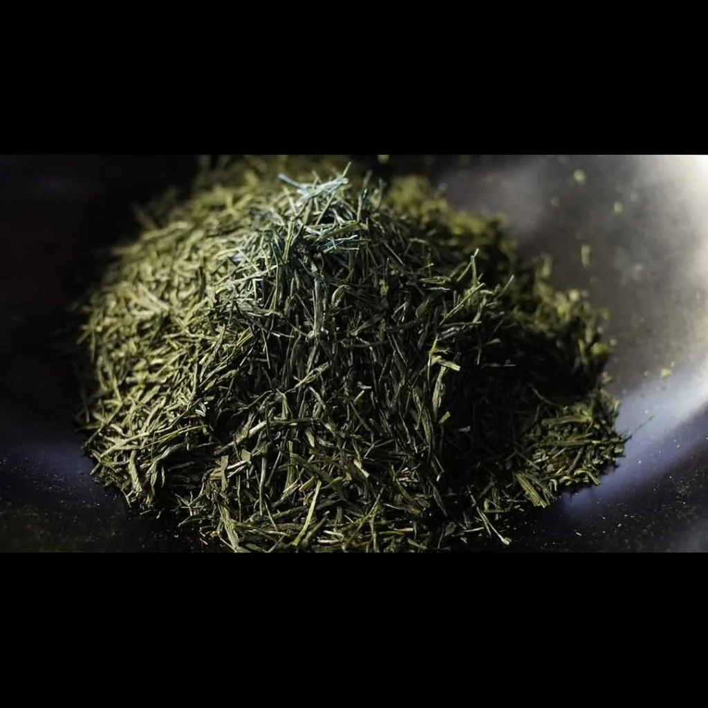 Close-up of a mound of dried green tea leaves