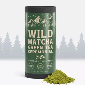 Green Wild Matcha ceremonial tea tin beside a mound of green powder