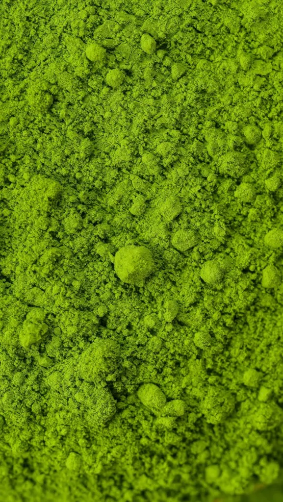 Macro view of bright green matcha powder with fine grains and small clumps